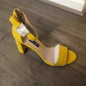 NWT and in box...Yellow suede open toe heels